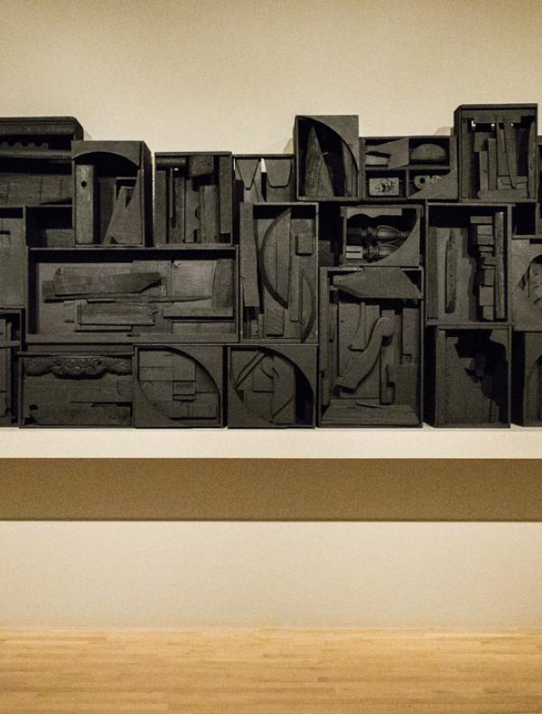 Assemblage of wooden refuse painted in black.