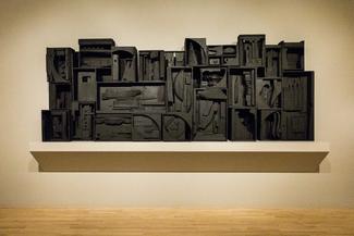 Assemblage of wooden refuse painted in black.