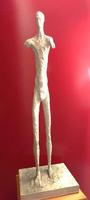 Homme sans bras (2) (partie du couple) Plâtre, homme en marche, sans bras (cassés probablement, forme filiforme ) 